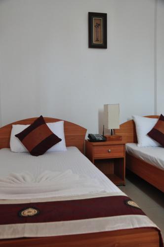 Postel nebo postele na pokoji v ubytování Villa Hotel