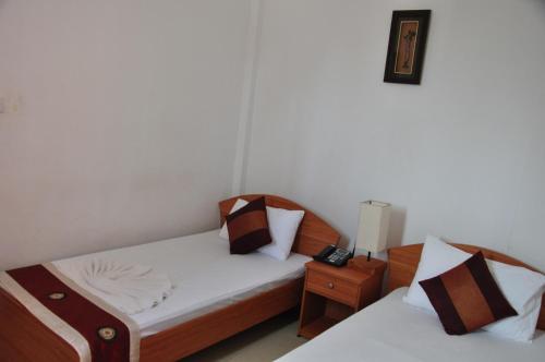 Postel nebo postele na pokoji v ubytování Villa Hotel