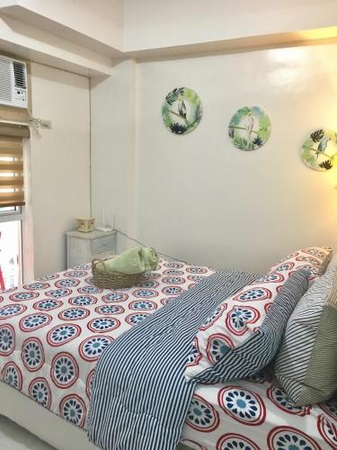 a bedroom with a cat laying on a bed at Sofia's Tagaytay Getaway in Tagaytay