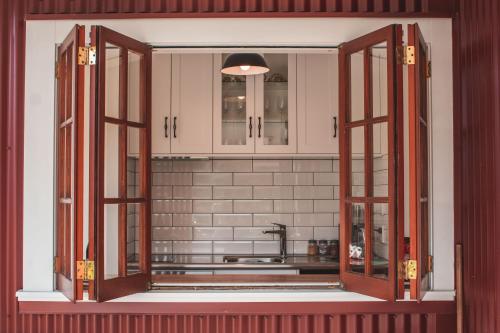 an open window in a kitchen with a sink at Woodside Orchard in Greytown