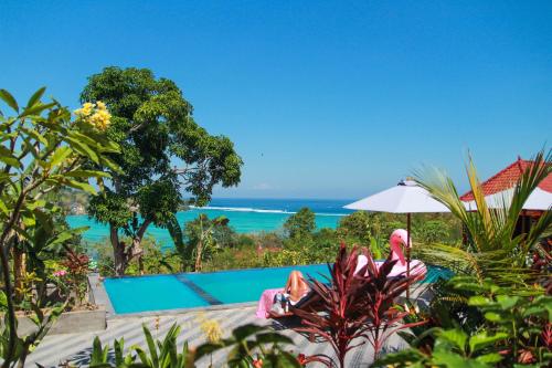 a view of the ocean from the pool at a resort at Bukit Permata Lembongan in Nusa Lembongan