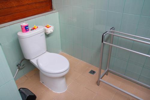 a bathroom with a white toilet in a room at Bukit Permata Lembongan in Nusa Lembongan