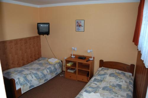 Łóżko lub łóżka w pokoju w obiekcie Hotel Bona