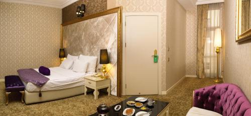 Кровать или кровати в номере Teatro Boutique Hotel