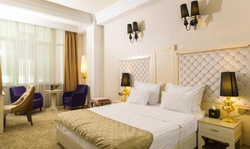 Кровать или кровати в номере Teatro Boutique Hotel