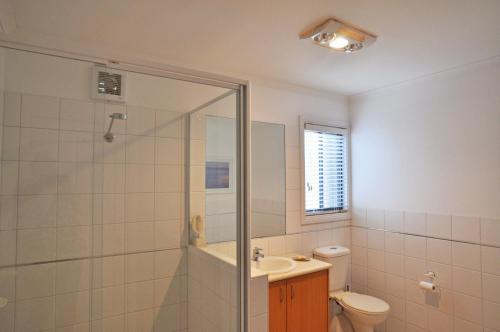 a bathroom with a shower and a toilet and a sink at BLISS - CLOSE TO TOWN in Inverloch