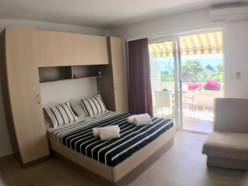 Giường trong phòng chung tại Apartment Bilalovic