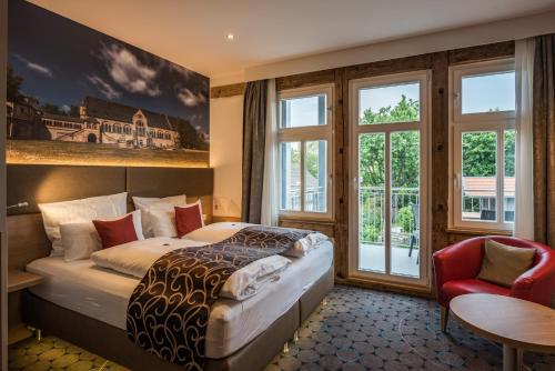 Postel nebo postele na pokoji v ubytování AKZENT Hotel Villa Saxer