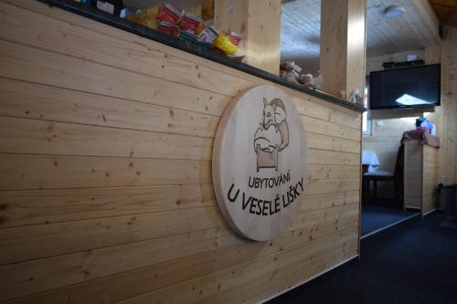 a sign on the wall of a restaurant at U Veselé lišky in Hutisko