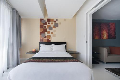 A bed or beds in a room at KL Serviced Residences Managed by HII