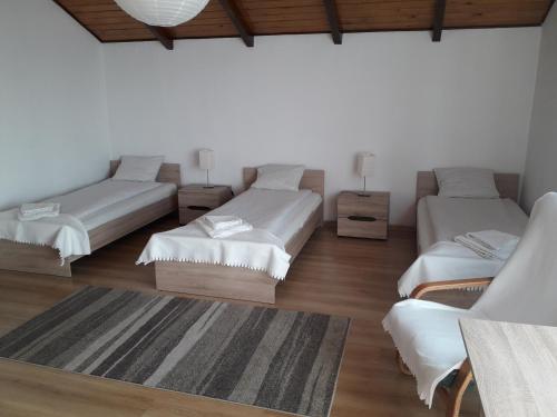 
A bed or beds in a room at Villa Osa Modlin Airport
