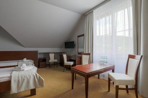 Postel nebo postele na pokoji v ubytování Hotel Skalite Spa & Wellness