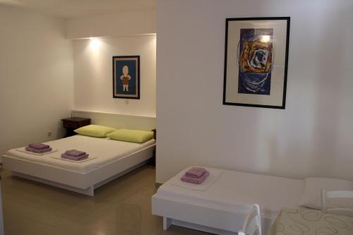 מיטה או מיטות בחדר ב-Apartments Giardino