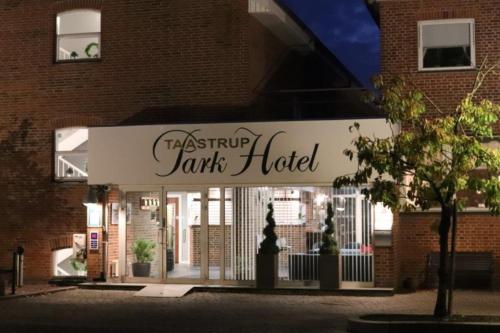 a sign for a bank hotel in front of a building at Taastrup Park Hotel in Tåstrup