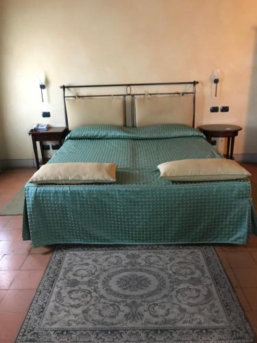 Кровать или кровати в номере Hotel La Cantina