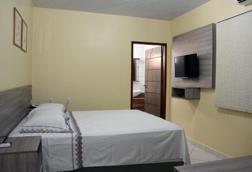 Кровать или кровати в номере Hotel Goiânia