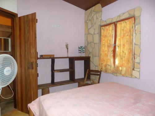 Posteľ alebo postele v izbe v ubytovaní Casinhas Vila Bonita Amarela