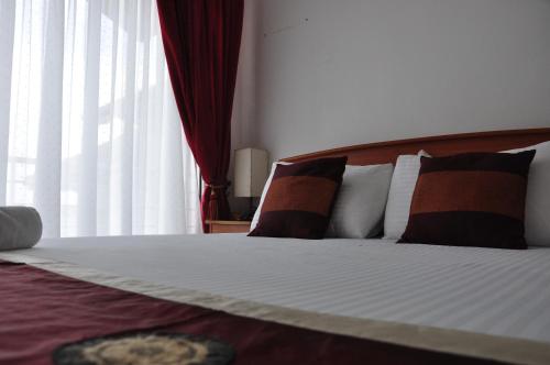 Postel nebo postele na pokoji v ubytování Villa Hotel