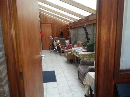 a hallway with a room with a table and chairs at The best known village of Belgium in Puurs