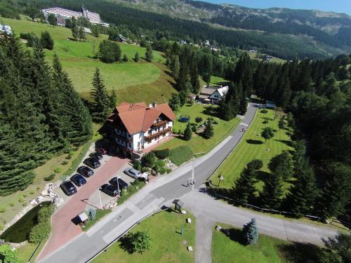 an aerial view of a large house in a field at Hotel Resort Martin & Kristyna in Špindlerův Mlýn