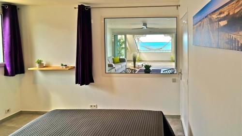 Una cama o camas en una habitación de Grand Case Beach