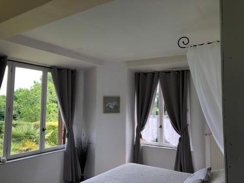 Ένα ή περισσότερα κρεβάτια σε δωμάτιο στο Chambre d'hotes Romance