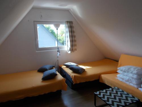 Giường trong phòng chung tại Bałtyckie Siedlisko