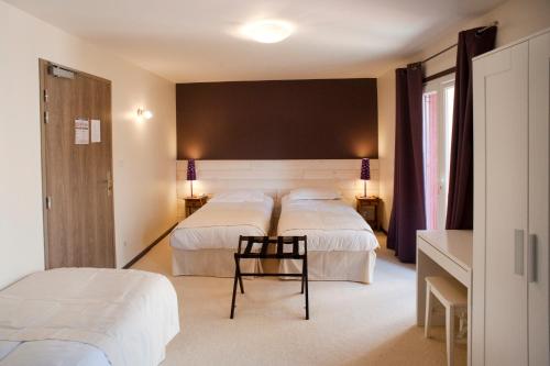 Postel nebo postele na pokoji v ubytování Comptoir et Dépendances