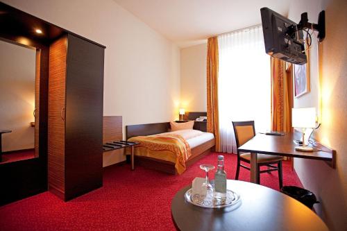 Letto o letti in una camera di Drexel´s Parkhotel