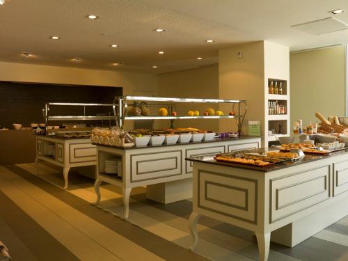 a buffet line with many different types of food at Son Moll Sentits Hotel & Spa - Adults Only in Cala Ratjada
