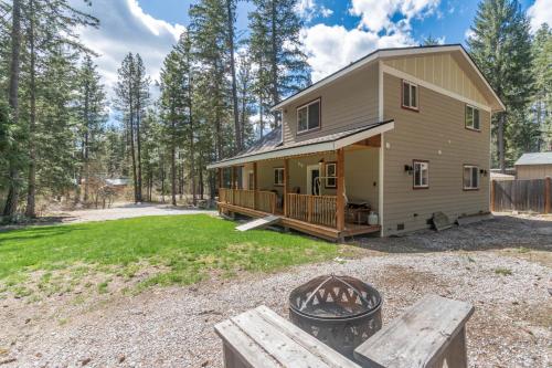 a house with a fire pit in front of it at Peaceful Pines in Plain