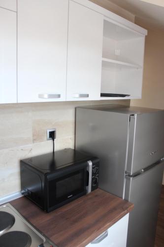 a microwave sitting on top of a counter in a kitchen at Emma Apartments in Bitola
