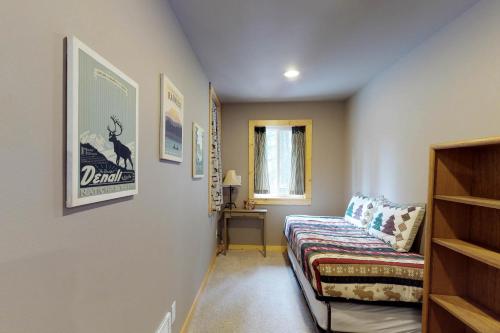 a room with a couch and a desk in it at Peaceful Pines in Plain