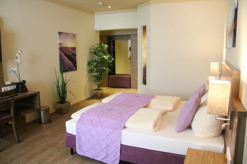 Postel nebo postele na pokoji v ubytování Boutique Hotel zur Post