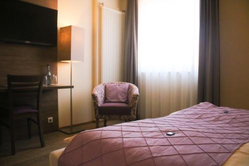 Postel nebo postele na pokoji v ubytování Boutique Hotel zur Post