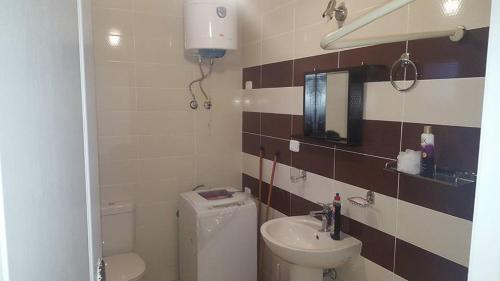 a small bathroom with a toilet and a sink at Apartment in Blue bay Asian Marsailla Families only chalet pool view قرية بلو باى اسيا مرسيليا العين السخنة in Ain Sokhna
