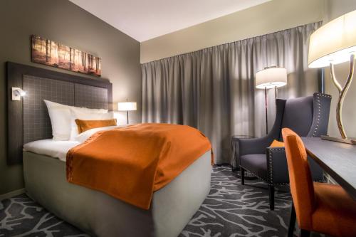 Postel nebo postele na pokoji v ubytování Soria Moria Hotell