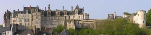 an old castle sitting on top of a city at les gîtes de l'argenterie à 15km du zoo de Beauval classés 4 étoiles in Fontguenand