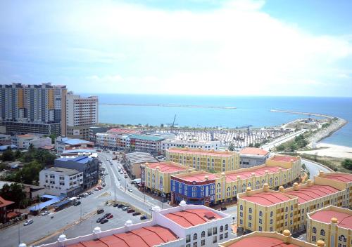 an aerial view of a city with buildings and the ocean at SEAVIEW HOLIDAY APARTMENT 4 - WiFi & Netflix in Kuala Terengganu