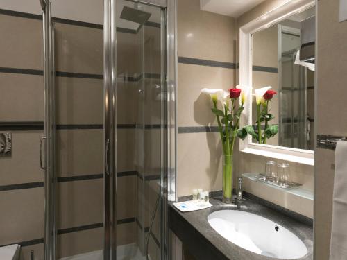 A bathroom at IG Suites