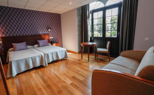 Postel nebo postele na pokoji v ubytování Hotel Rey Silo