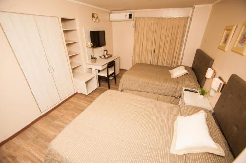 Postel nebo postele na pokoji v ubytování Hotel Posadas
