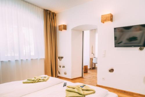 TV o dispositivi per l'intrattenimento presso Amtshaus Gut Hügle Boutique Apartments