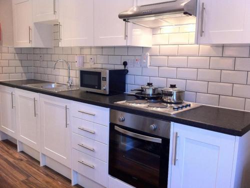 A kitchen or kitchenette at Lyall Apartment Hotel