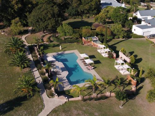 an aerial view of a house with a swimming pool at White Water Farm in Stanford