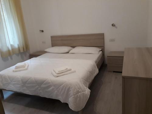 Katil atau katil-katil dalam bilik di Appartamento Chiara