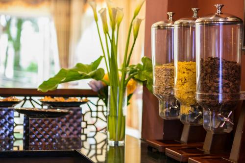 a vase with a plant in it on a table at Sapa Horizon Hotel in Sa Pa
