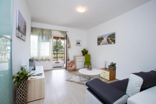 Ruang duduk di Apartments Green Garden