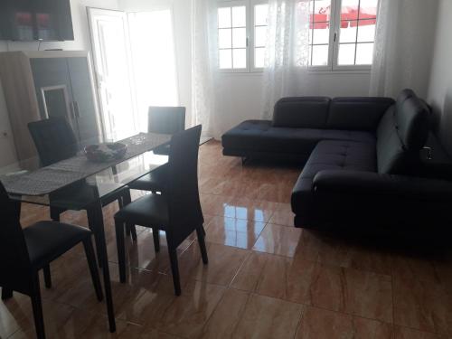 a living room with a couch and a table at Casa Olivina 2 in Puerto del Carmen