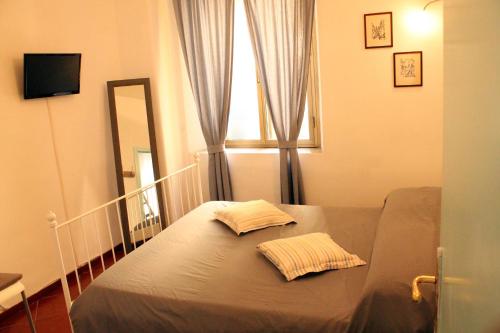 En eller flere senge i et værelse på Apartment - Laterano 85